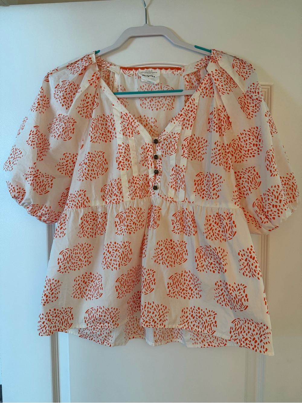Anthropologie Cream Peasant Top with Orange Print